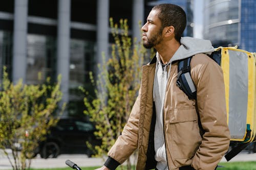 Man in Brown Jacket Standing 