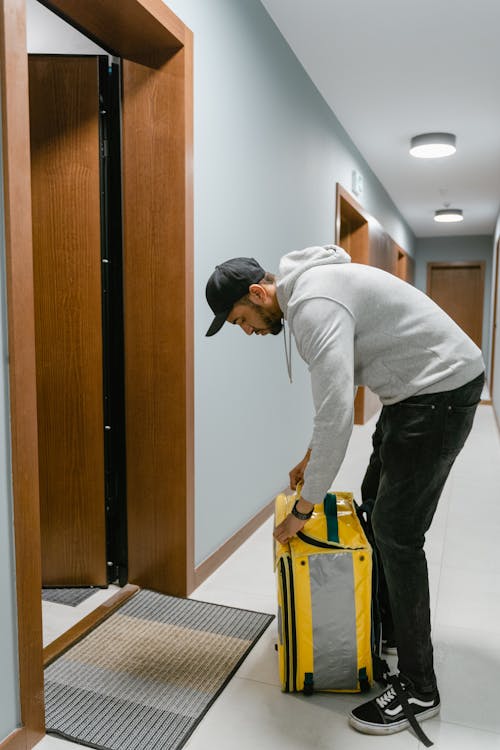 Deliveryman Opening his Bag