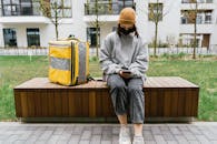 Woman in Gray Sweater Sitting on a Bench