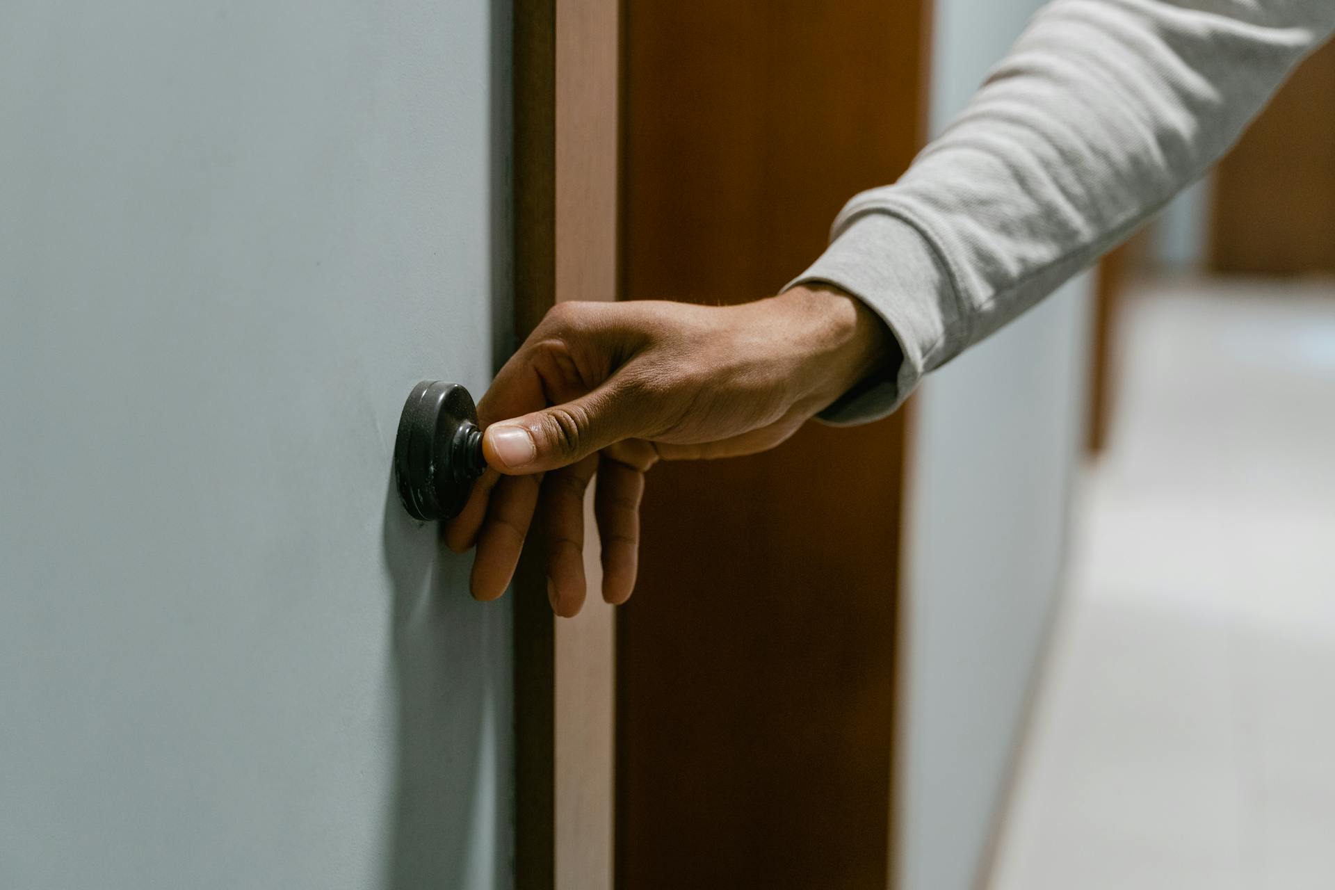 Person Ringing the Doorbell