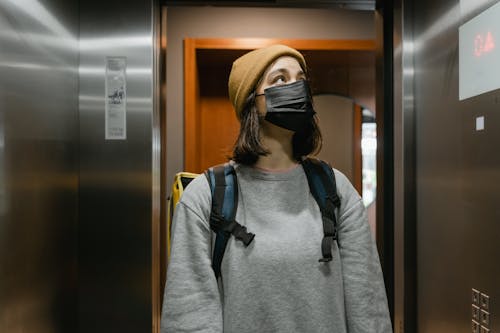 Woman Inside an Elevator
