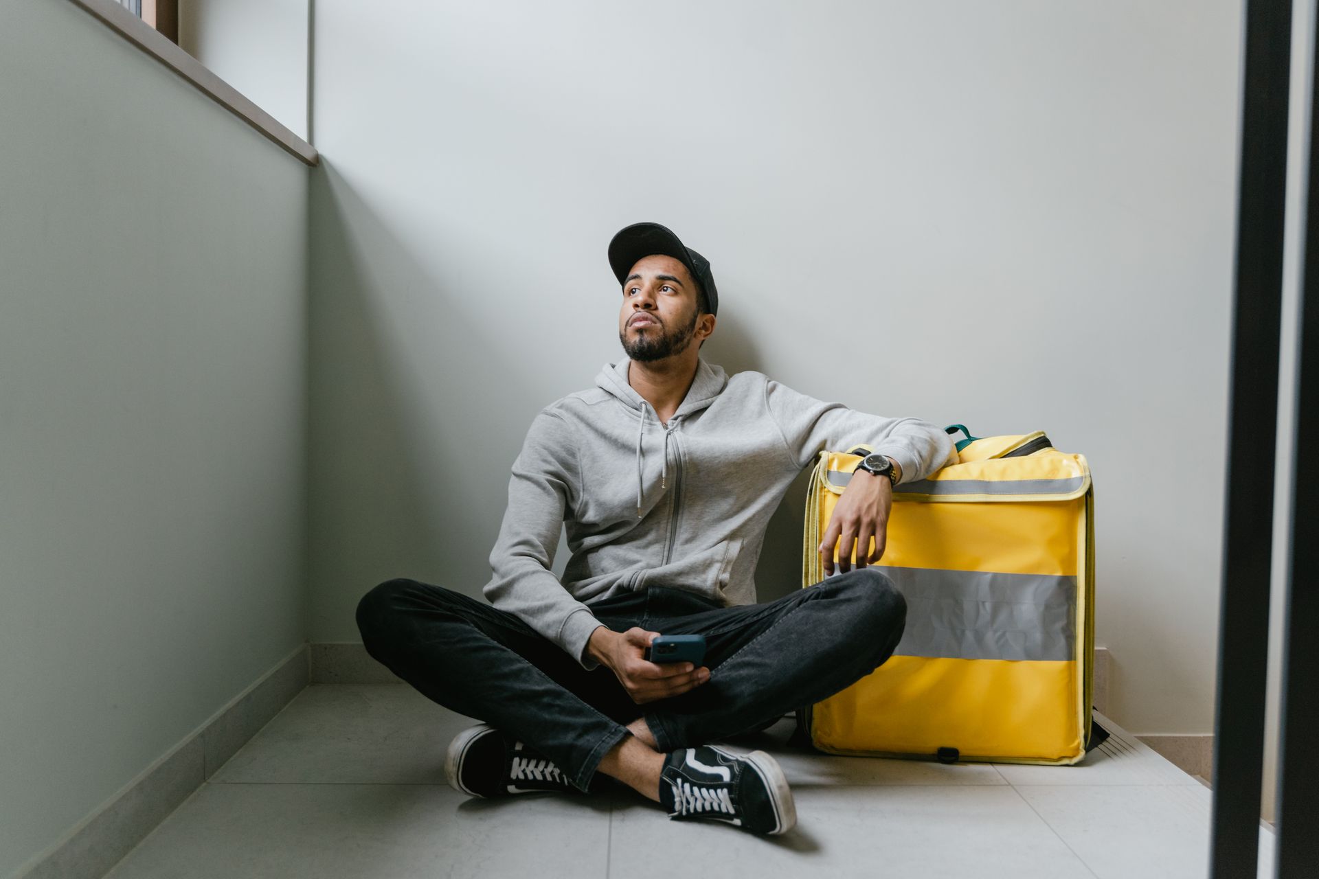 Man Sitting on the Floor Waiting