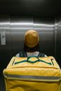 Deliveryman Inside an Elevator