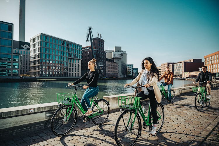 Group Of Friends Riding A Bike Together