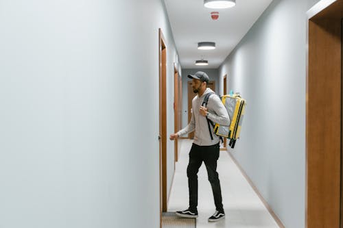 Man Walking Towards a Door