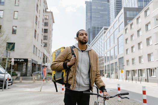 Cyclist navigating city streets with a delivery backpack for urban logistics.