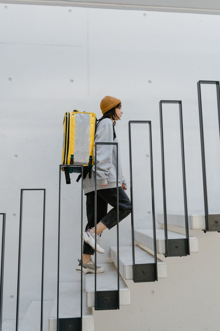 Woman Going Up The Stairs