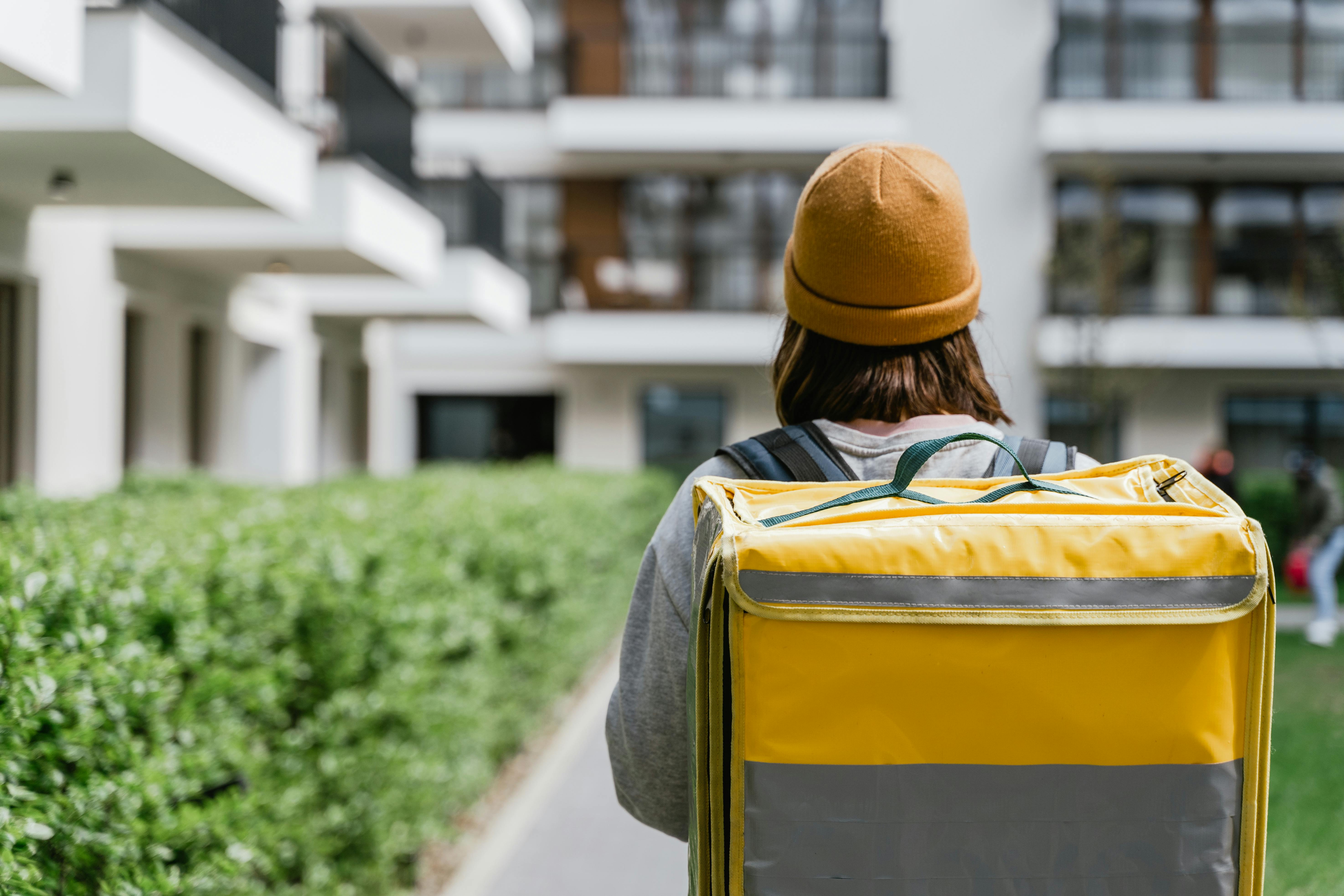 Person Carrying a Yellow Bag · Free Stock Photo