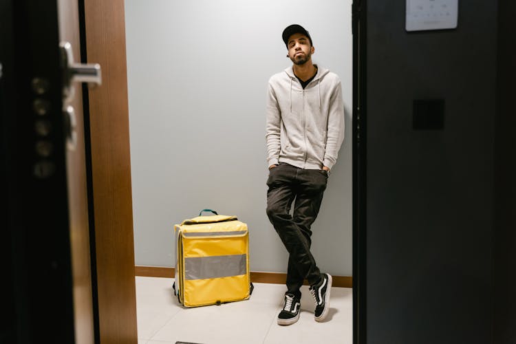 Man Waiting By The Door