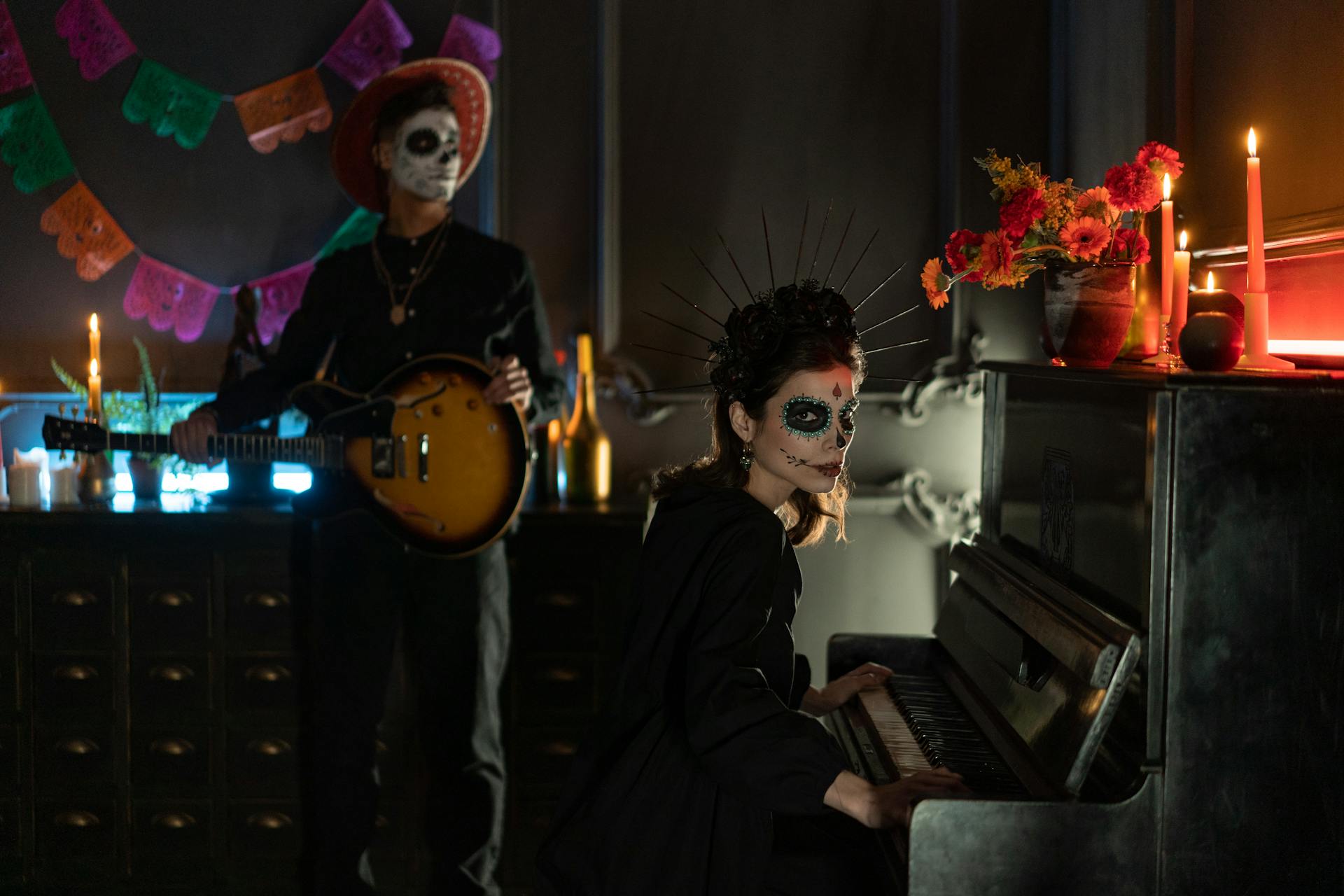 Woman in Halloween Costume Sitting in Front of Piano