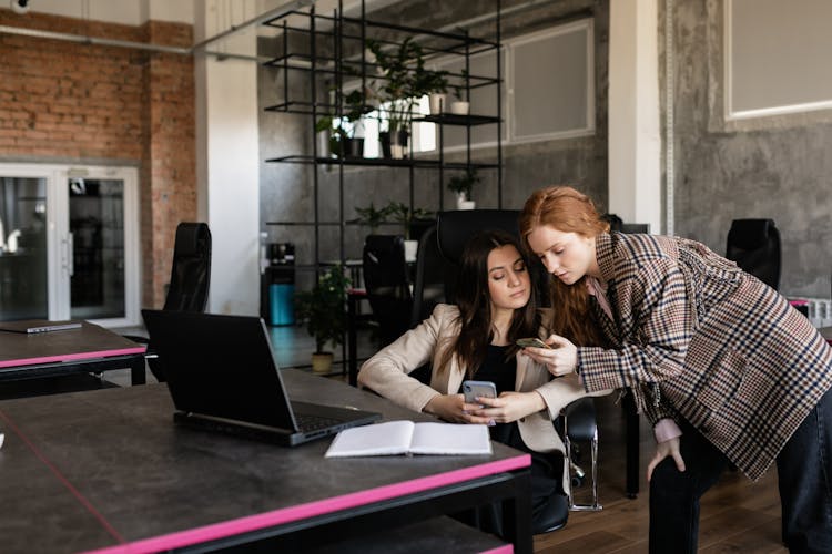 Two Women Working In The Office