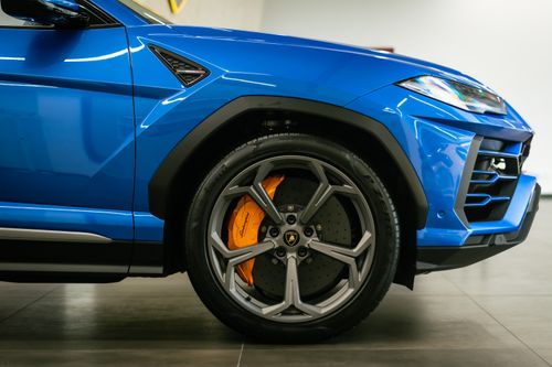 Free Detailed close-up of a blue Lamborghini sports car showcasing the wheel and design. Stock Photo