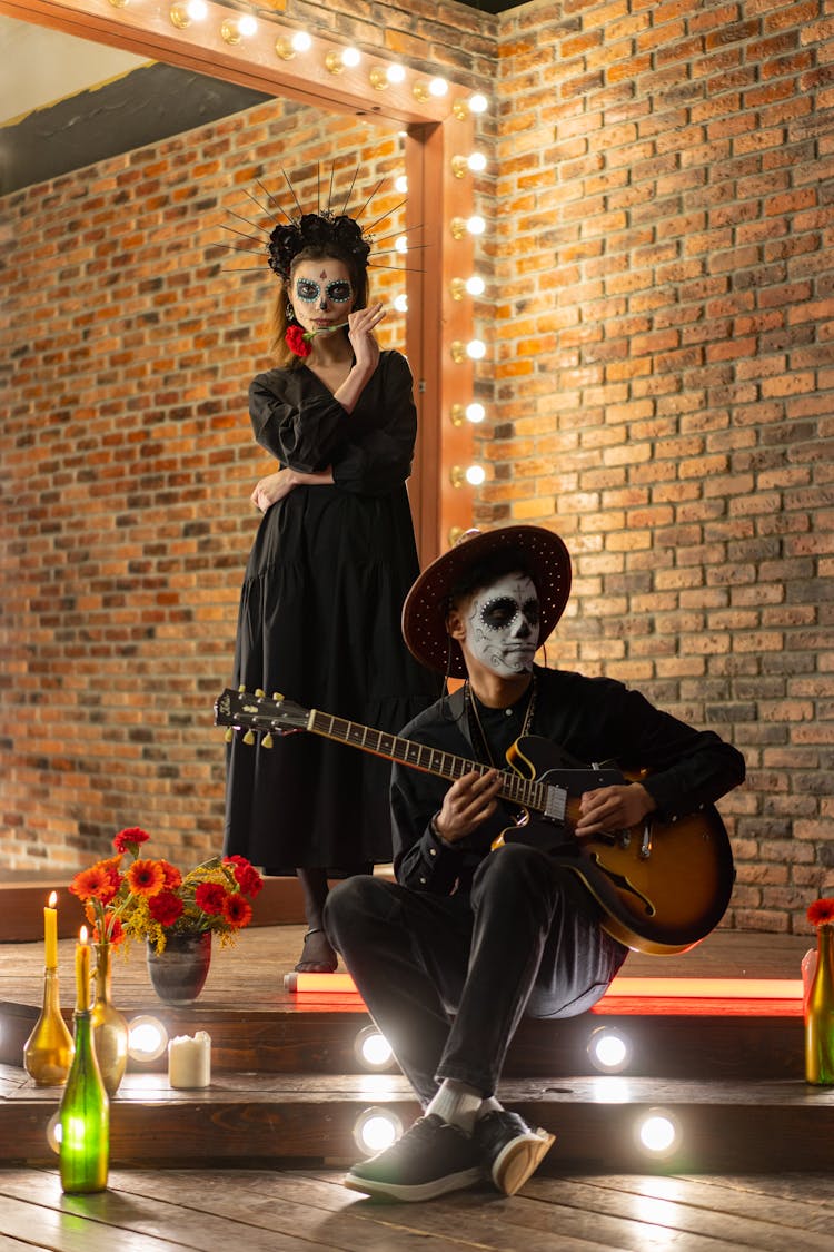 A Man And A Woman Celebrating The Day Of The Dead