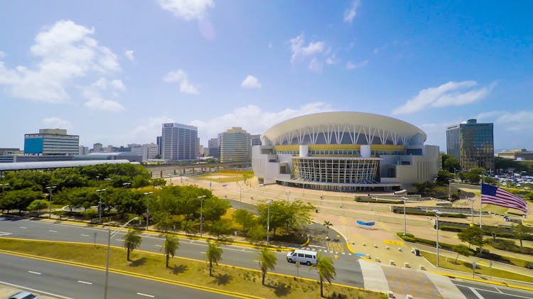 Cityscape With Modern Buildings And Indoor Stadium In Daylight