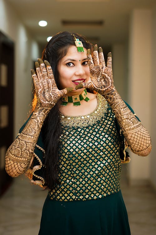 Free Photograph of a Woman with Mehndi Tattoos on Her Hands Stock Photo