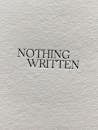 Minimalist textured white paper sheet of book with printed Nothing Written black inscription