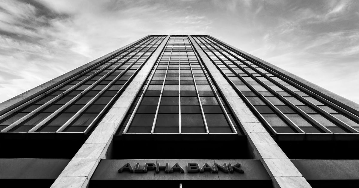 A striking black and white photo of a high-rise building in Athens, Greece.