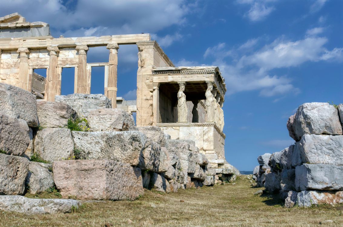 Greek Temple Between Rocks Photograph of a Temple Near Rocks · Free Stock Photo