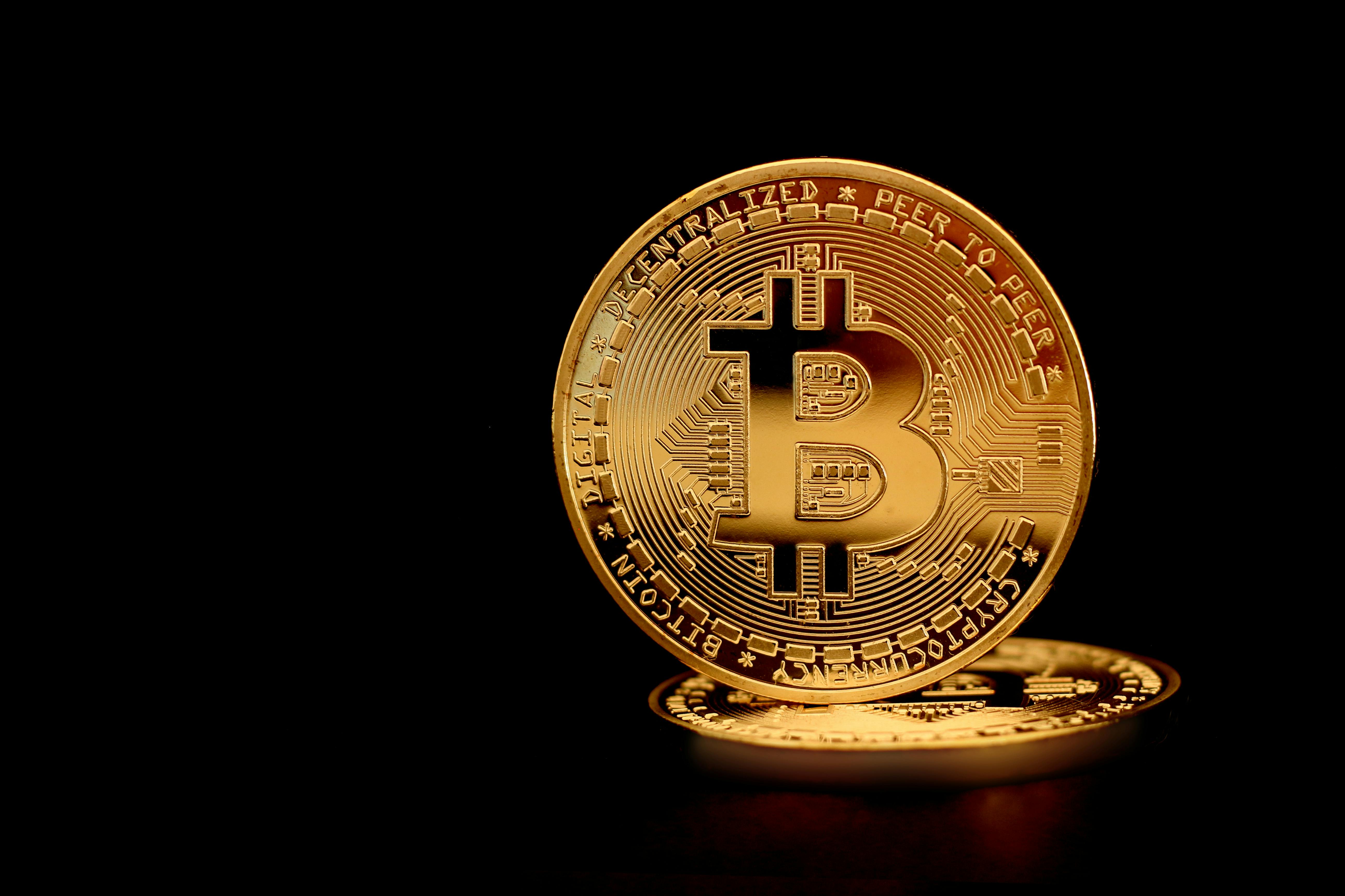 close up photograph of a gold bitcoin