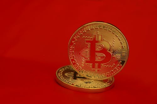 Gold Round Coin on Red Background