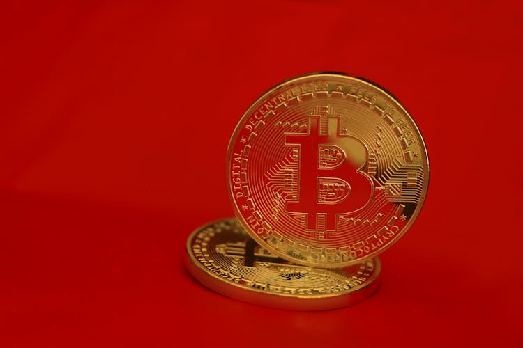 Gold Round Coin On Red Background