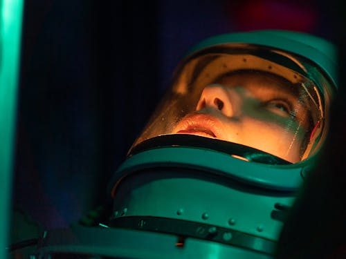 Person in Green and Black Space Suit