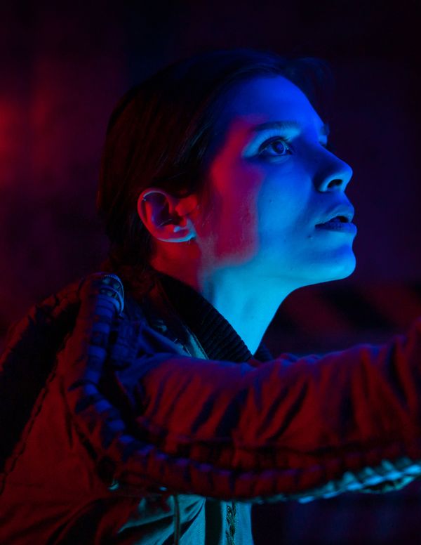 Cyborg face with blue light reflections