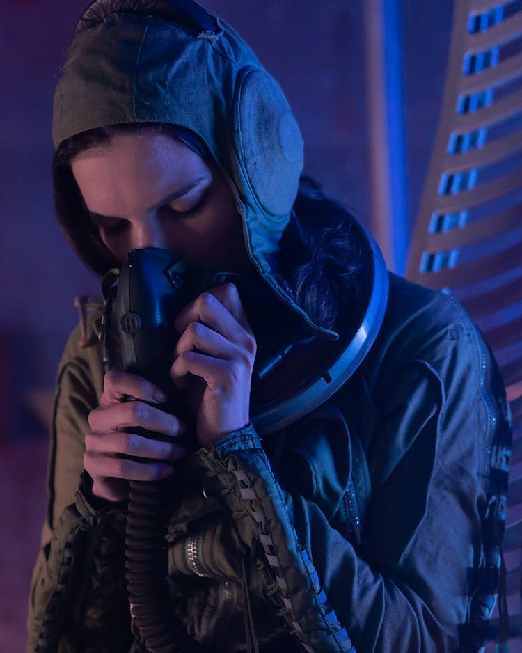 Woman In Space Suit Breathing For Oxygen