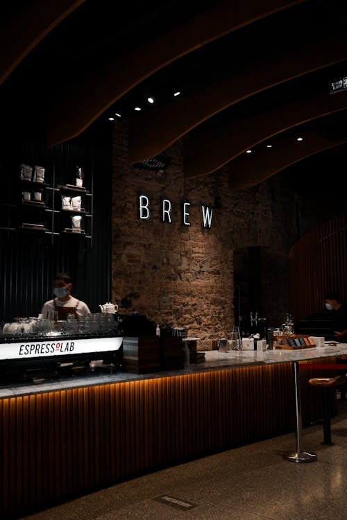 Free Interior of cafe with barista behind counter Stock Photo