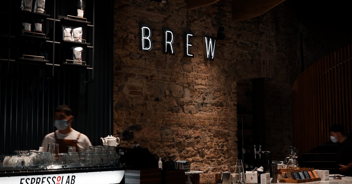 Interior of cafe with barista behind counter · Free Stock Photo