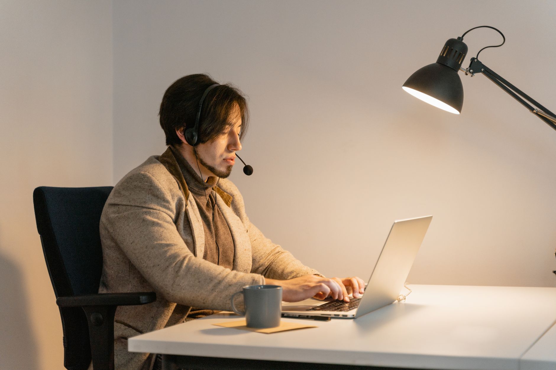 lofi music ADHD focus lofi music adhd focus — person wearing headphones working at cozy desk warm lamp light laptop