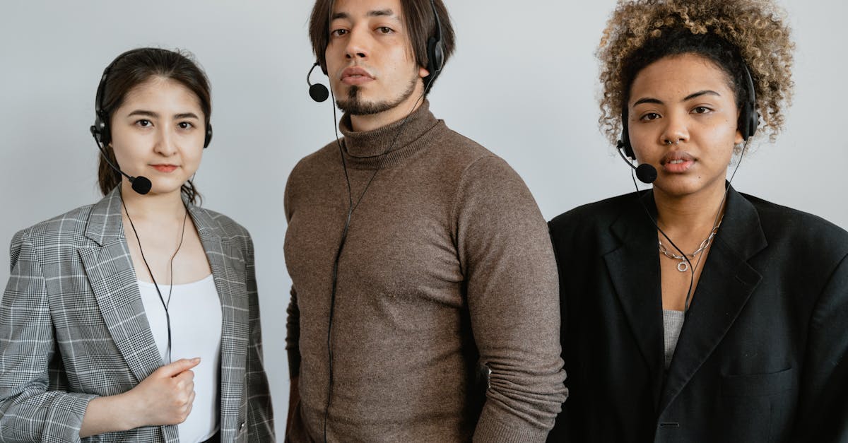A diverse team of customer support professionals wearing headsets in an office setting.