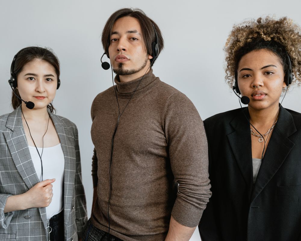 Diverse customer support team wearing headsets in an office