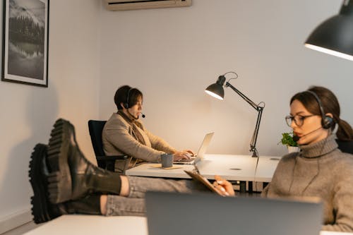 A Man and a Woman Working on the Call Center