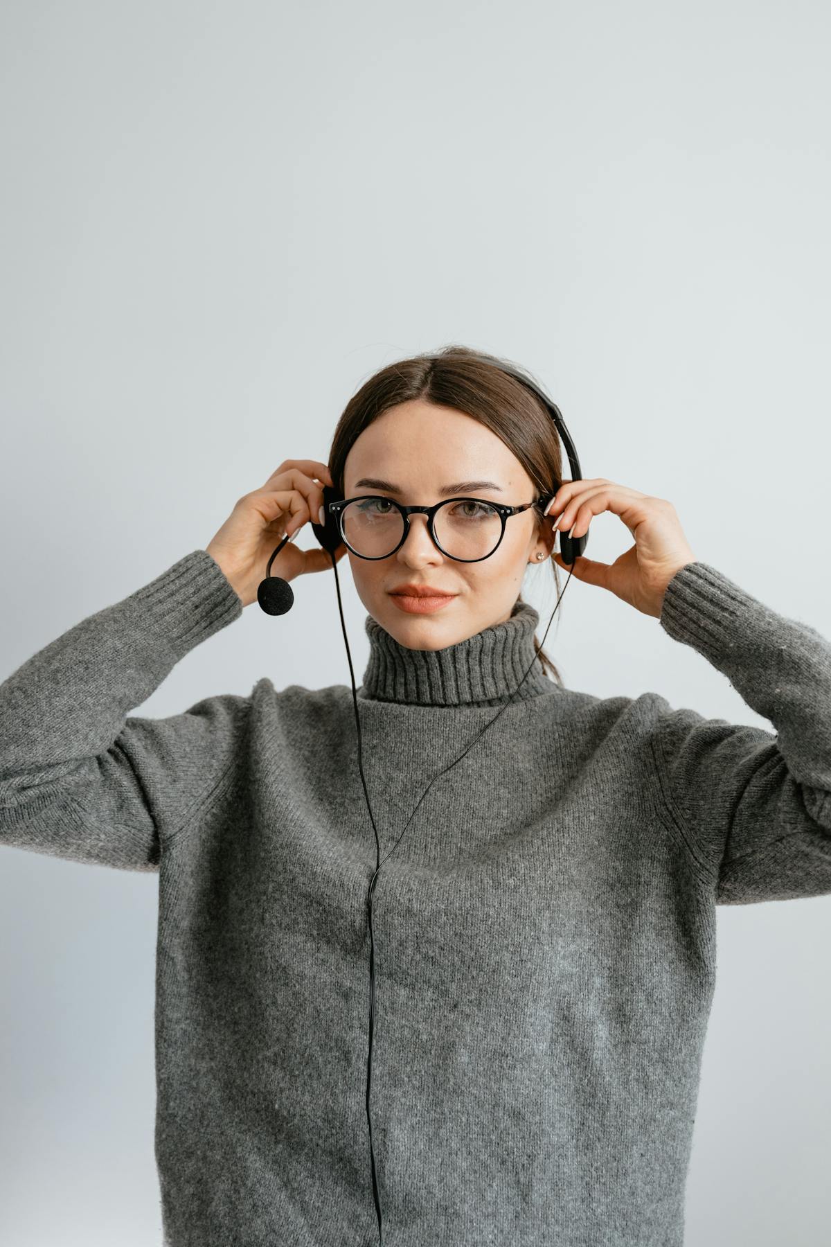 Person using a smartphone AI chat application at a desk