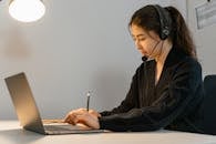 A Working Wearing Headphones while Working