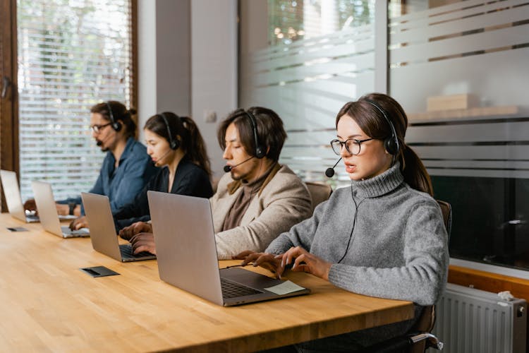 Photograph Of Agents Working On Their Laptops