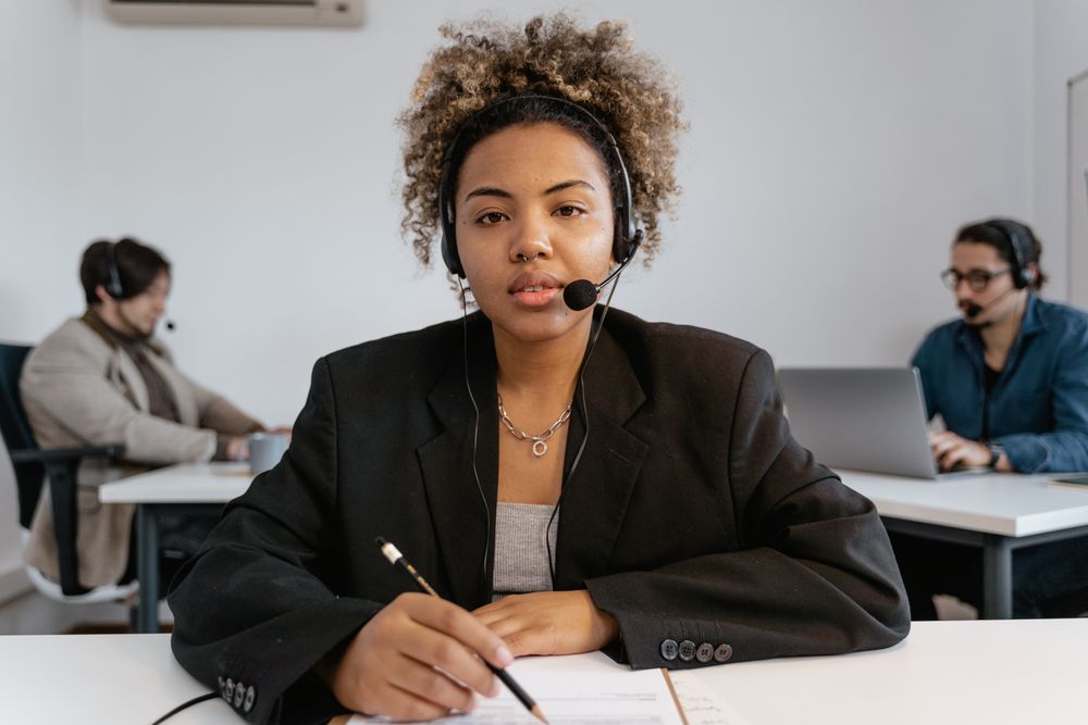 A remote patient coordinator wearing a headset