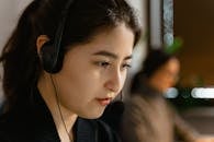 A Close-Up Shot of a Woman Wearing a Headset