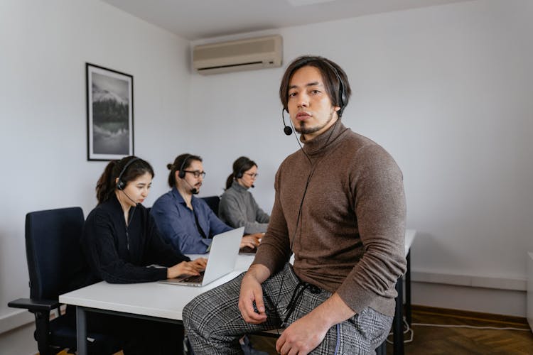 Man Sitting Inside The Call Center Office