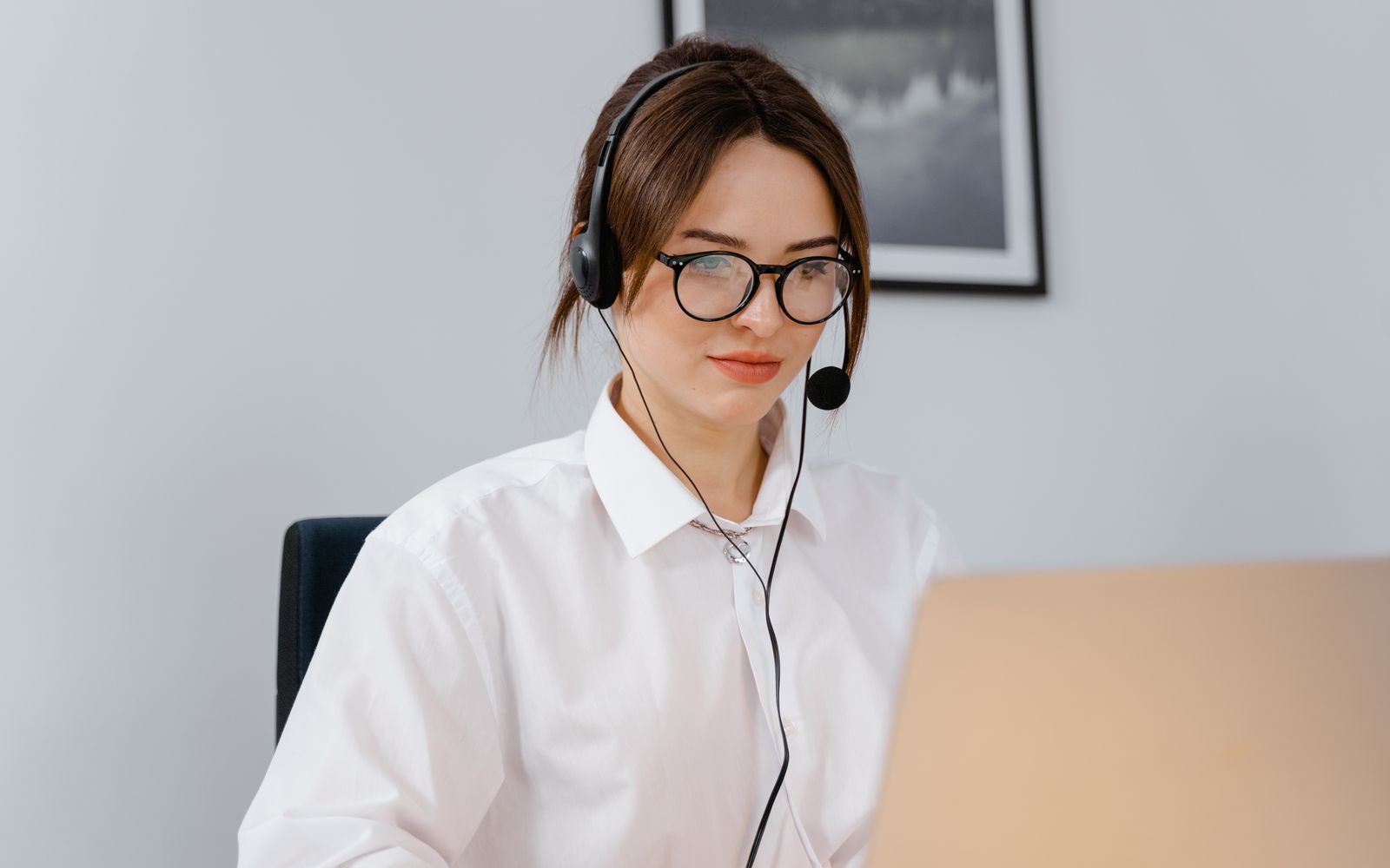 Customer service professional wearing a headset while working