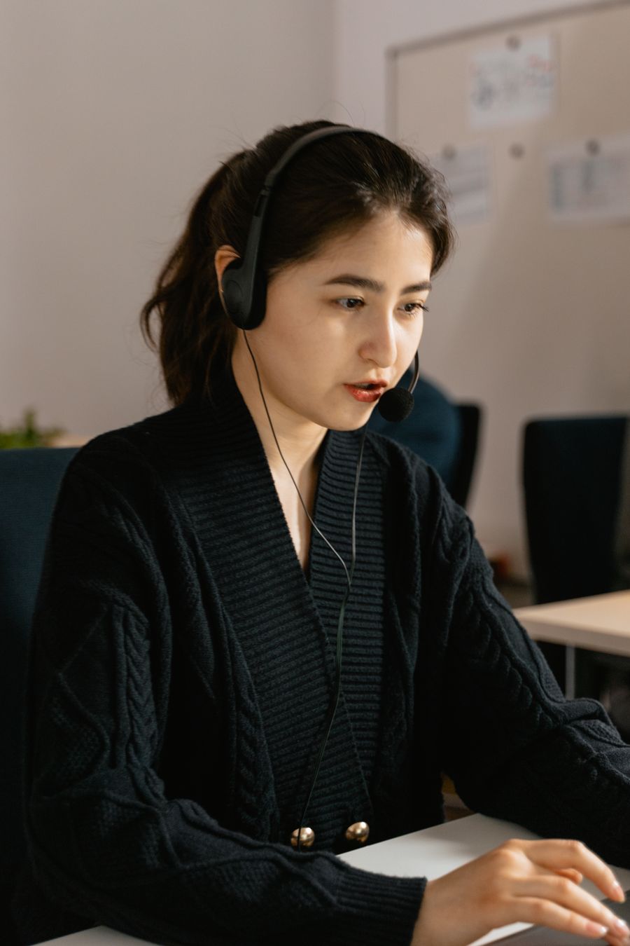 Customer support representative coordinating an engineer request