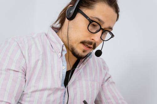 Close-Up Photograph of a Man with Facial Hair Working