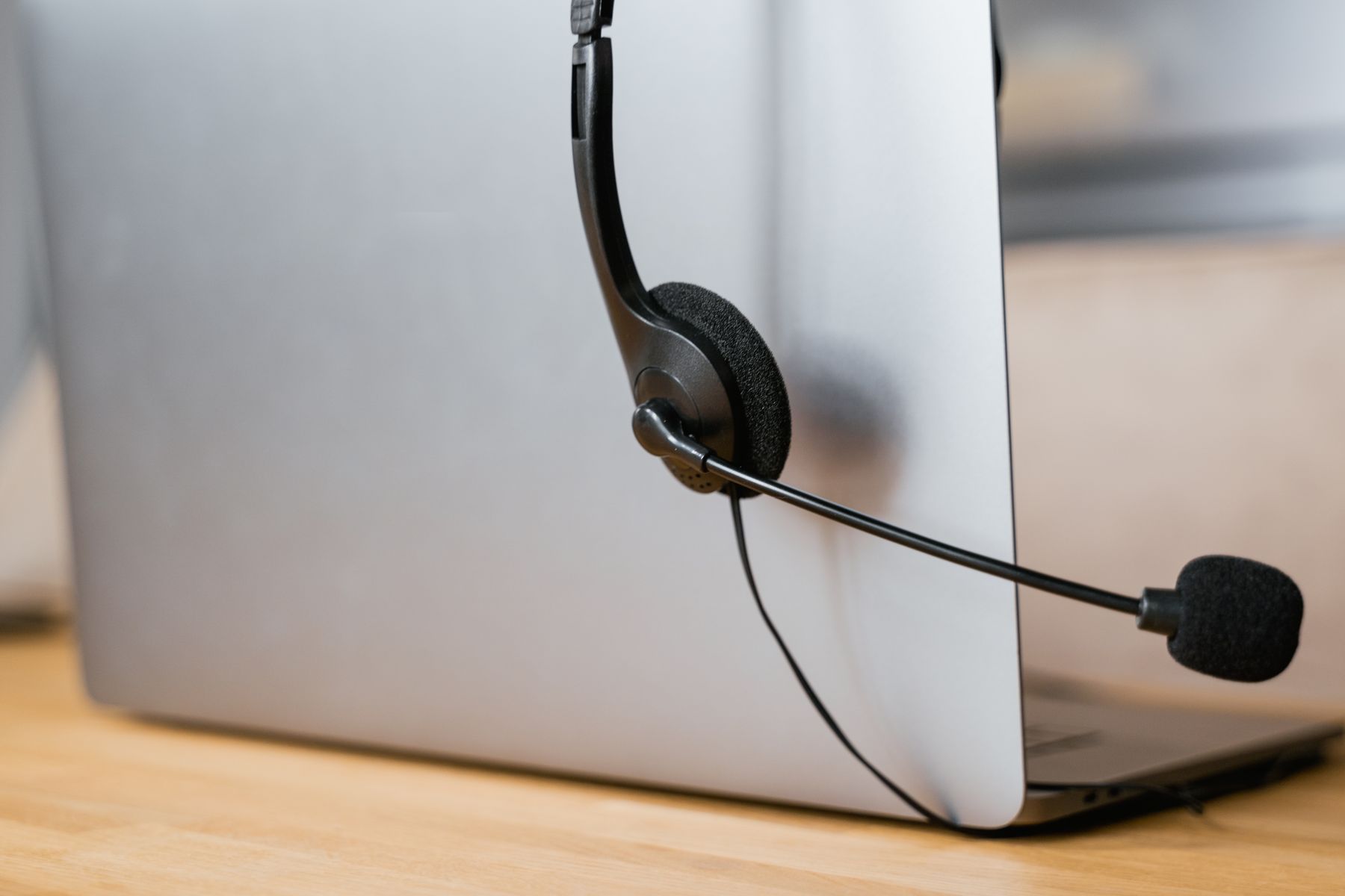 Headset and laptop representing managed support operations