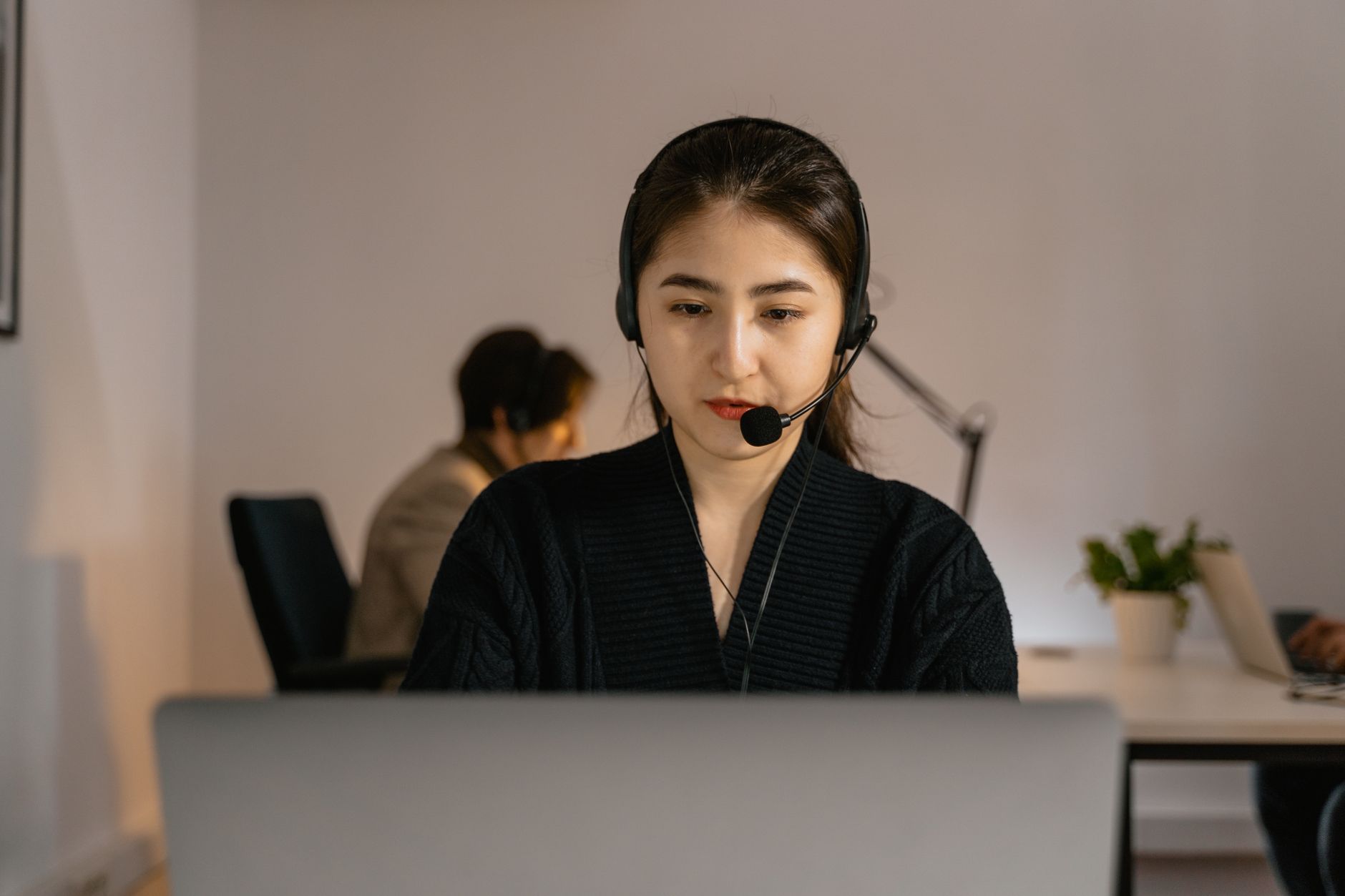 Anonymous hotline staff recording a detailed animal cruelty report with maps and timestamps on a computer