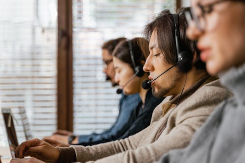 Free People Working as Call Center Agents Stock Photo
