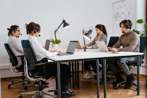 Free People Working in Call Center Stock Photo