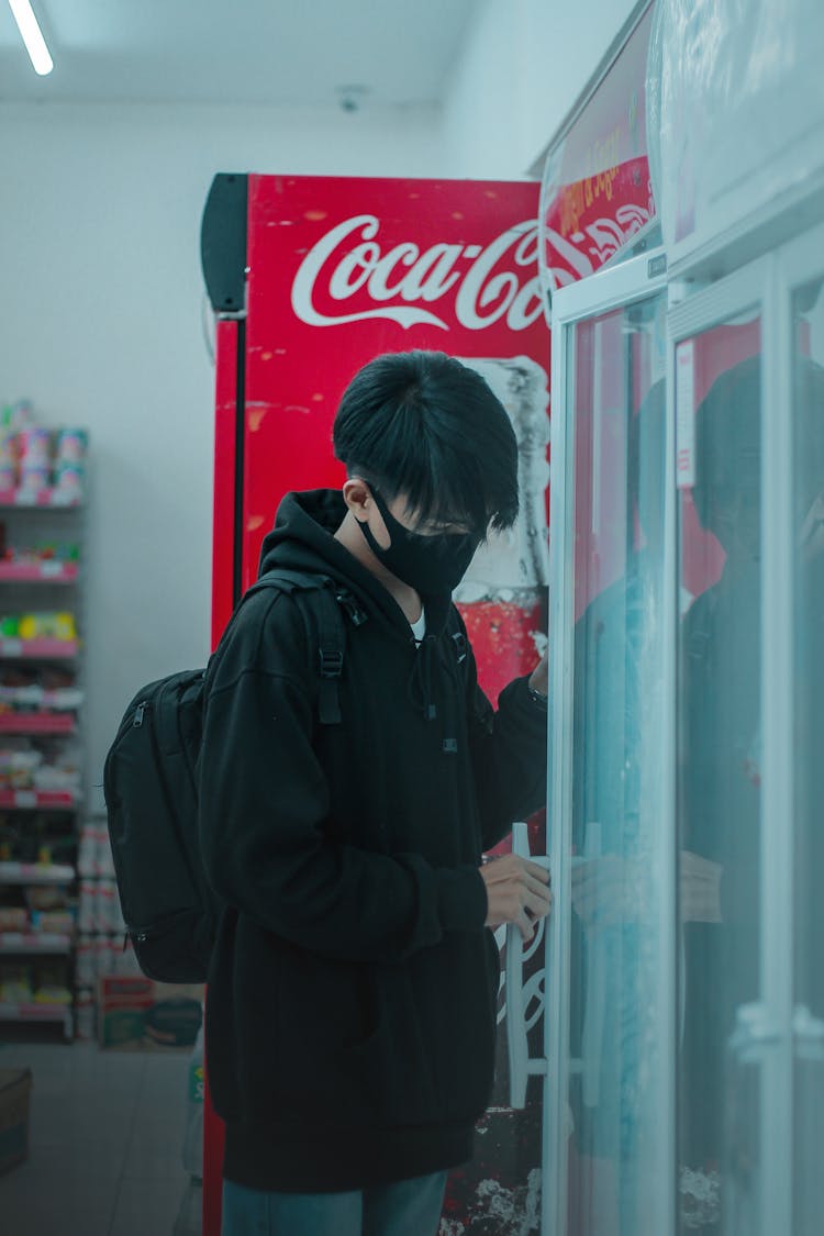 Photo Of A Boy Opening A Refrigerator Door