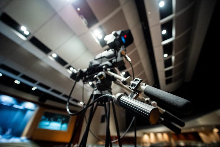 Video Camera On Tripod In Studio