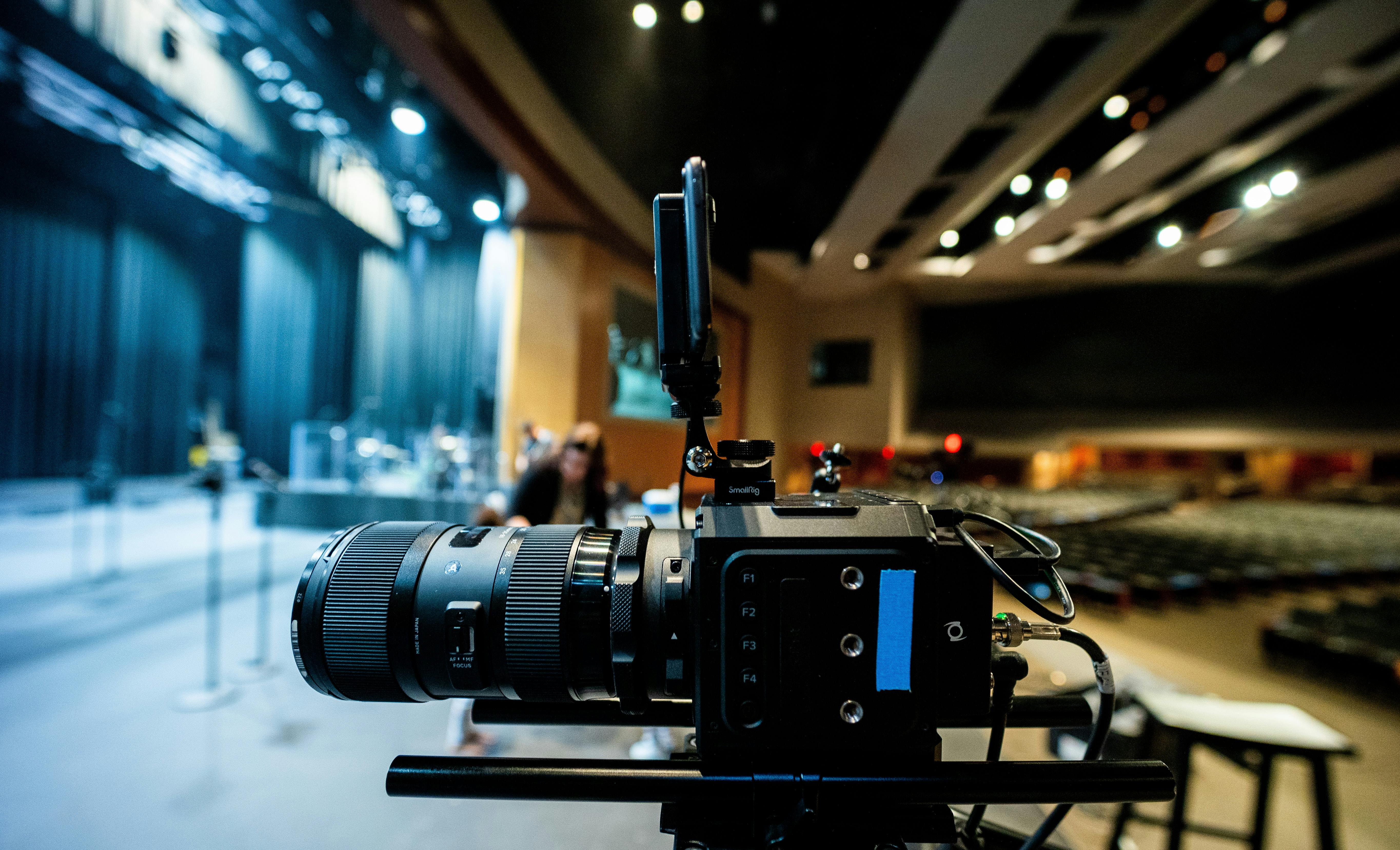 modern video camera placed near stage